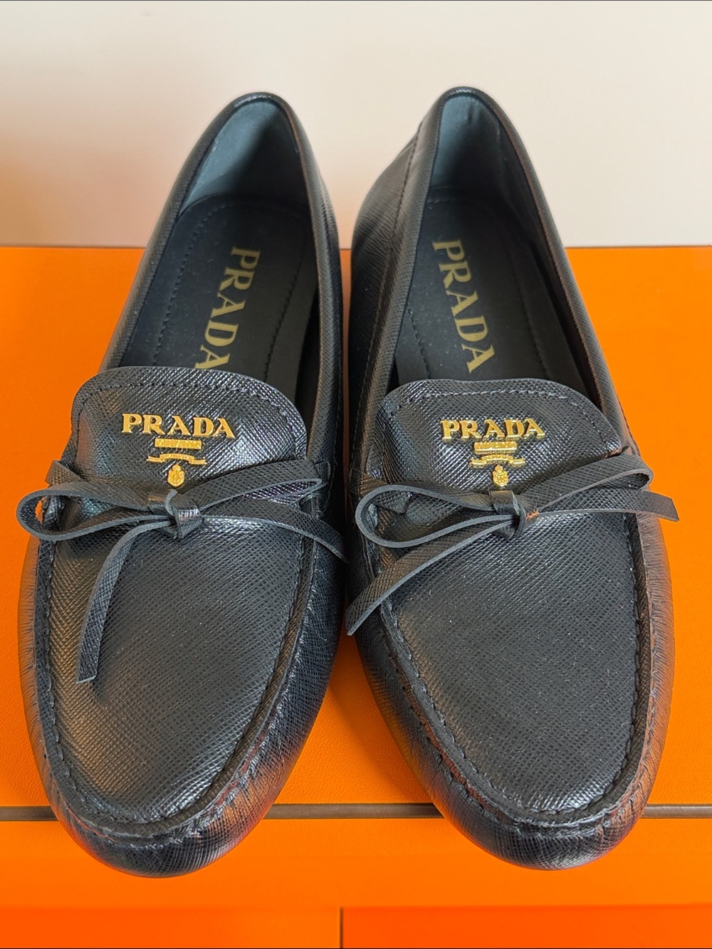 Prada Black Saffiano Leather Bow Loafers with Gold Logo